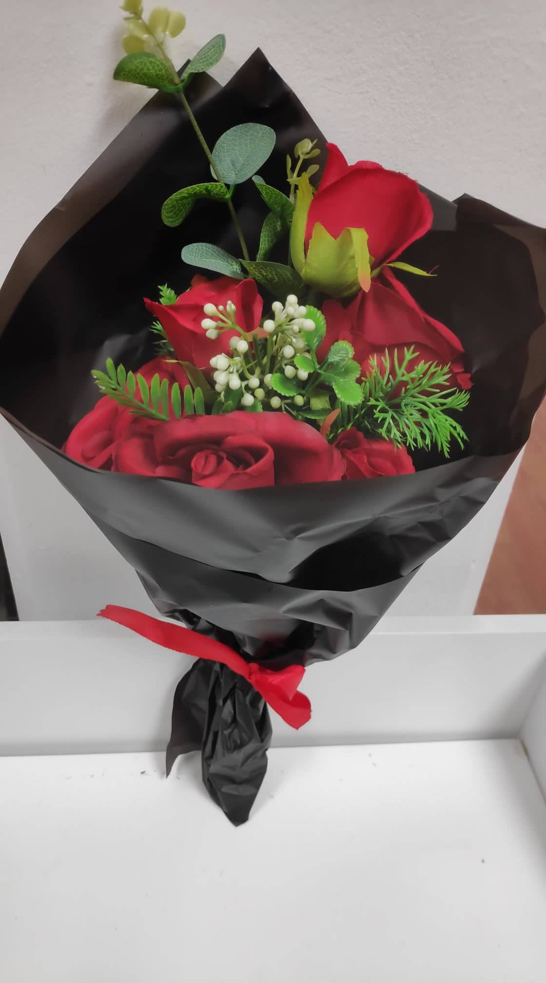 WRAPPED ROSE BOUQUET WITH EUCALYPTUS FOLIAGE AND SATIN BOW RED/BLACK - Evergreen Silk Plants