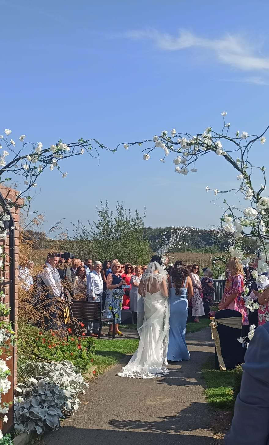 Enchanted blossom tree aisle decor with lanterns for wedding ceremony