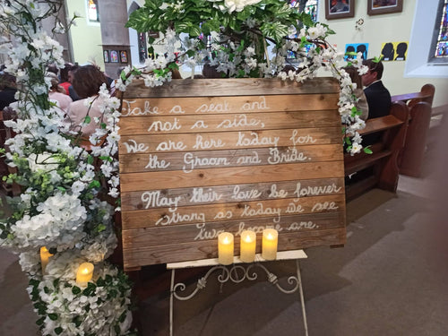 Cherry blossom wedding welcome sign with florals and lantern styling