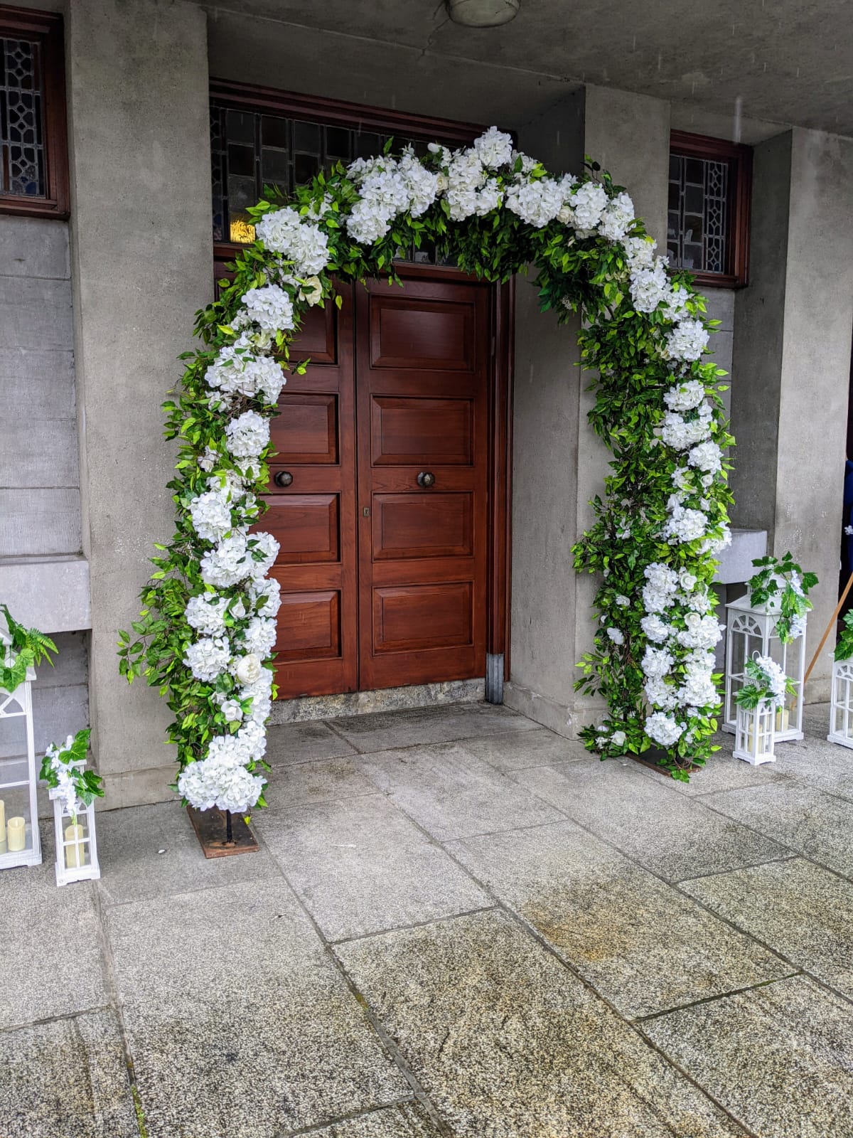 White floral entrance arch for Cherry Blossom wedding ceremony decor